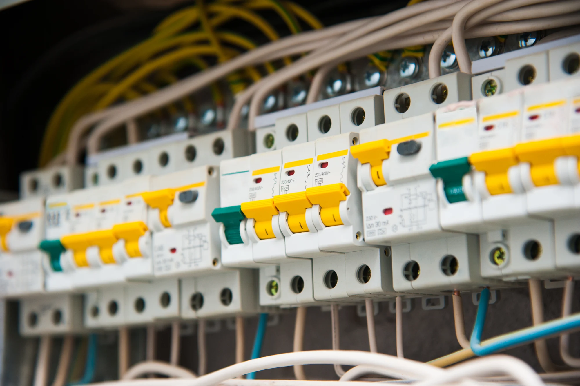 Row of 30 mA RCBO safety switches and circuit breakers in an upgraded switchboard